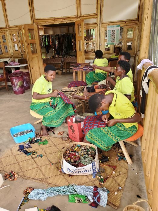 Women weaving baskets at Ride 4 A Woman community centre near Bwindi Impenetrable Forest, Uganda