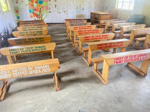 Teacher at Imbaseni Primary School near Arusha Tanzania — dedicated educators leading the Arusha region in national exam results